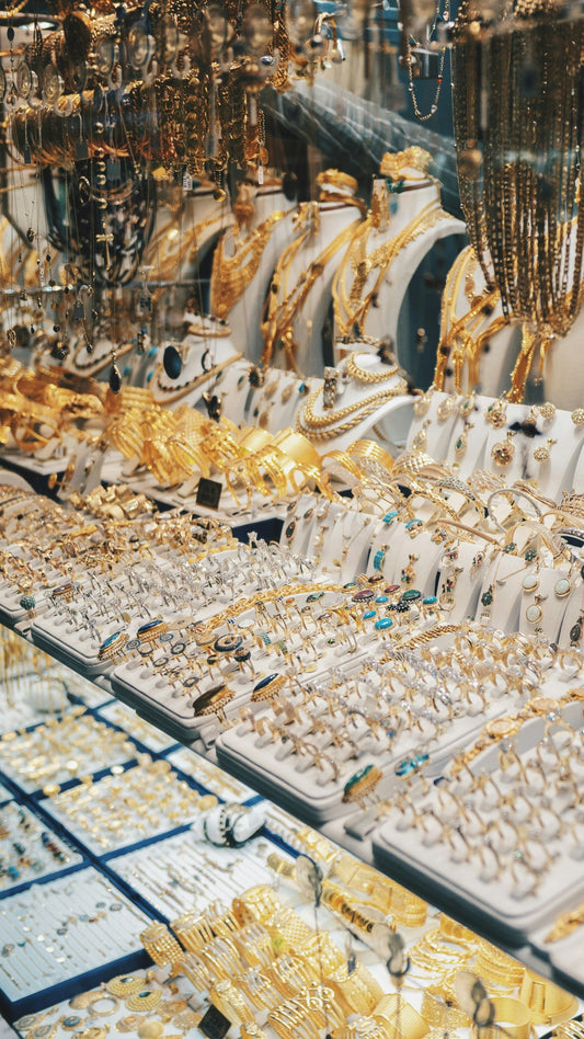 gold jewelry displayed on trays